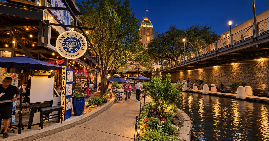 A lively river-level city walkway